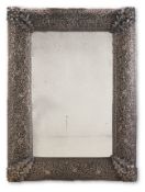‡ A LARGE INDIAN SILVER MOUNTED WALL MIRROR, CIRCA 1910