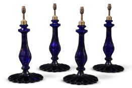 A SET OF FOUR DEEP 'BRISTOL' BLUE GLASS TABLE LAMPS, MODERN
