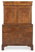 A QUEEN ANNE WALNUT AND FEATHERBANDED CABINET ON CHEST, CIRCA 1710