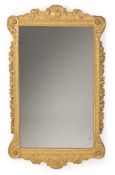 A GEORGE II CARVED GILTWOOD MIRROR, CIRCA 1740