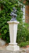 A LEAD FIGURE OF THE SEATED PAN IN THE CLEFT OF A TREE, EARLY 20TH CENTURY