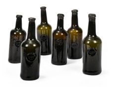A SET OF SIX LATE BRISTOL GREEN GLASS WINE BOTTLES, 18TH CENTURY