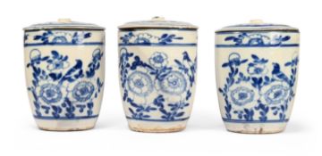 A SET OF THREE BLUE AND WHITE TIN GLAZED EARTHENWARE LIDDED STORAGE JARS, LATE 19TH CENTURY