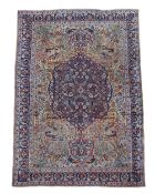 A TABRIZ CARPET, SIGNED BY MASTER WEAVER 'GHANADI', CIRCA 1890