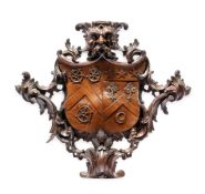 A GEORGE II CARVED WALNUT ARMORIAL CARTOUCHE, CIRCA 1740