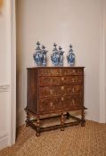 A QUEEN ANNE OLIVEWOOD OYSTER, WALNUT AND HOLLY CHEST ON STAND, CIRCA 1710