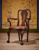 A GEORGE I 'RED WALNUT' OPEN ARMCHAIR, IRISH, CIRCA 1720