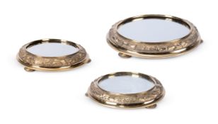 A VICTORIAN SCOTTISH SILVER GILT SUITE OF THREE MIRROR PLATEAUX, GEORGE EDWARD & SONS GLASGOW 1879