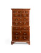 A GEORGE II WALNUT AND FEATHERBANDED CHEST ON CHEST, CIRCA 1730
