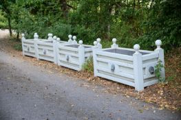 A SET OF FOUR GREY PAINTED TEAK AND BRASS MOUNTED RECTANGULAR PLANTERS, CONTEMPORARY