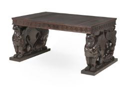 A CARVED MAHOGANY AND LEATHER INSET PEDESTAL DESK, IN REGENCY STYLE, CONTEMPORARY