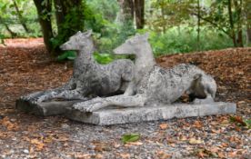 A PAIR OF ARTIFICIAL STONE RECUMBENT GREYHOUNDS, ATTRIBUTED TO AUSTIN & SEELEY, CIRCA 1840