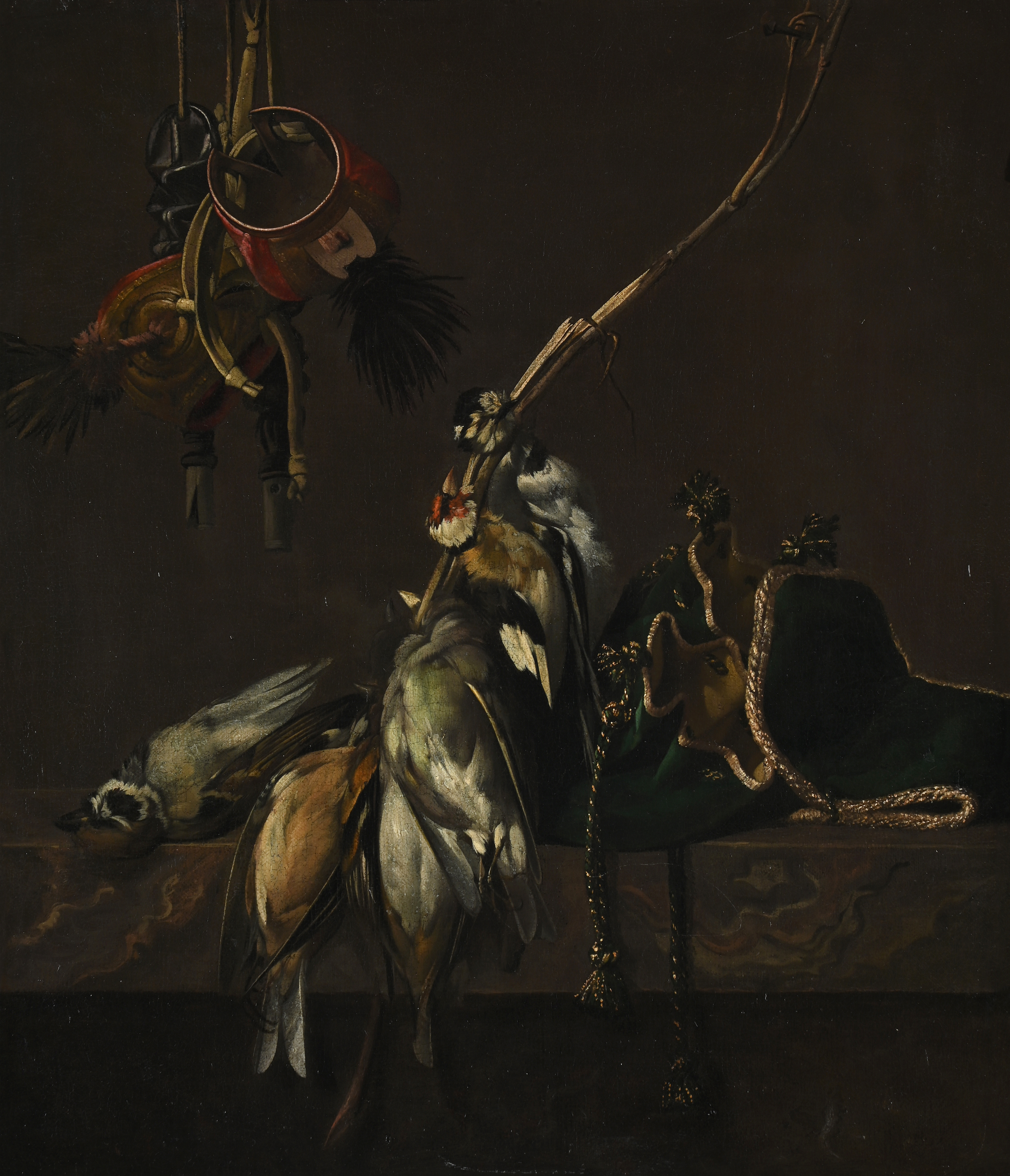 WILLEM VAN AELST (DUTCH 1627- AFTER 1687), STILL LIFE WITH HANGING HAWKING HOODS, BIRDS AND A GREEN