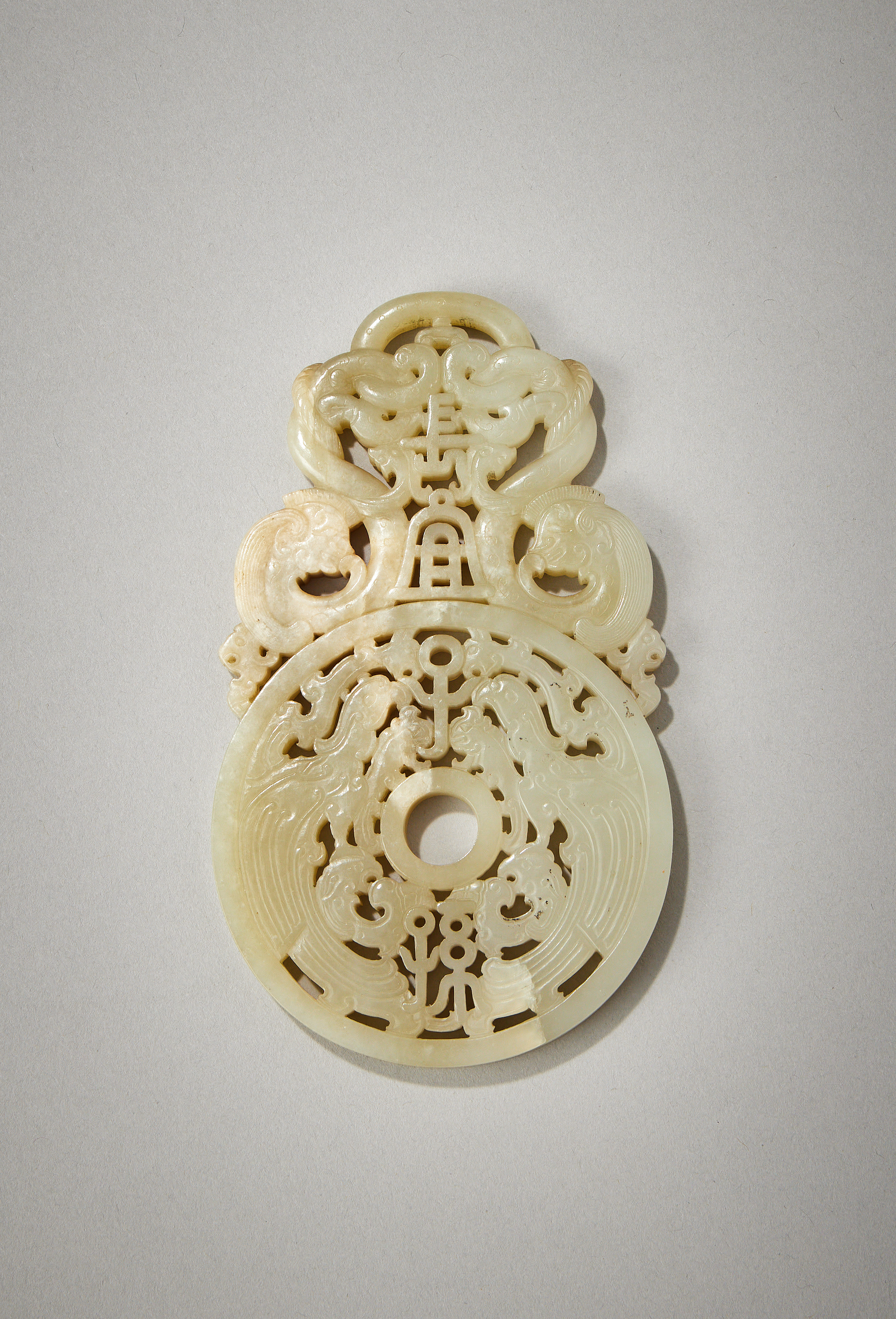 A Chinese pale celadon and white jade plaque