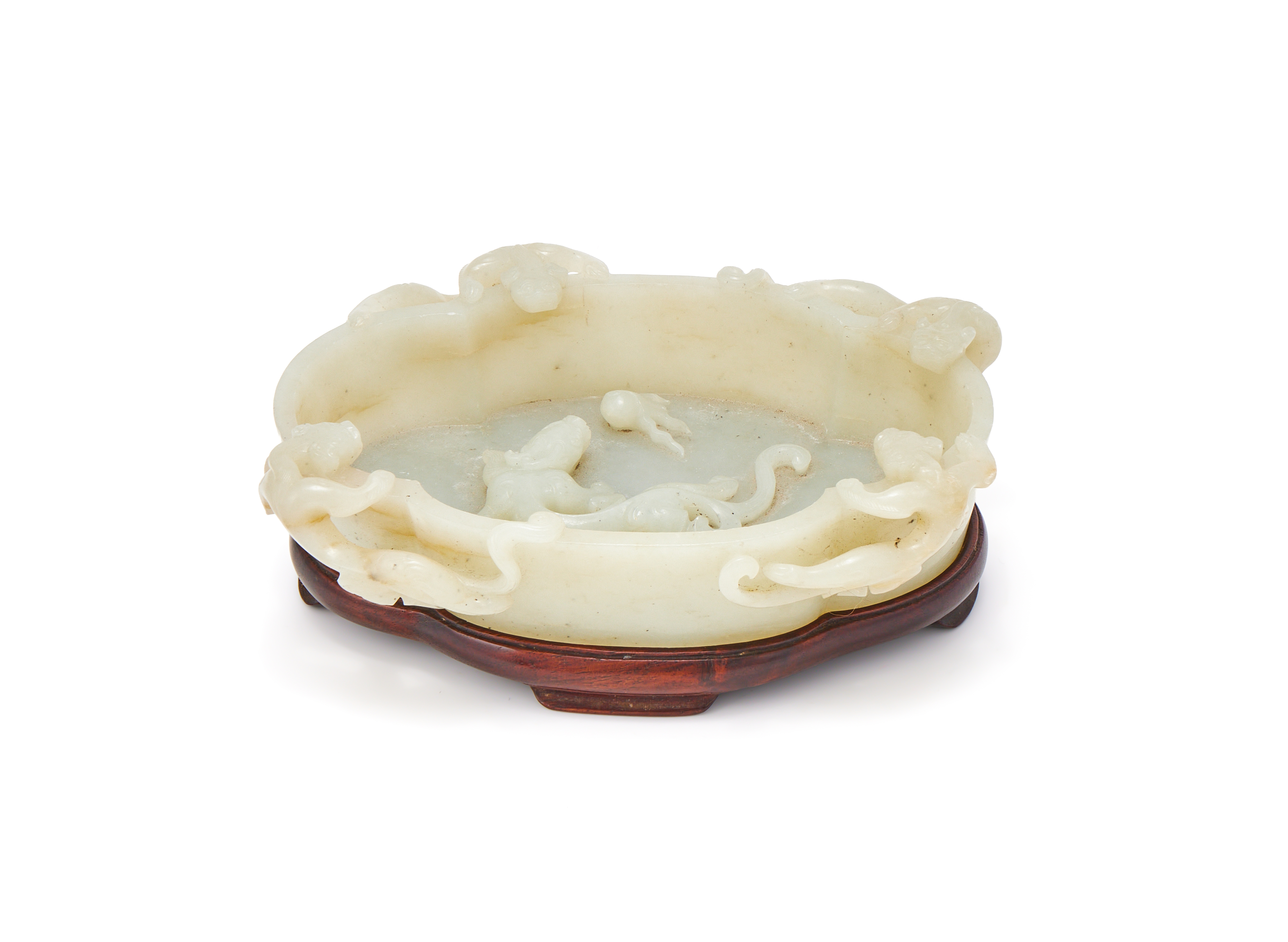 A Chinese white jade ‘Dragons’ washer, Qing Dynasty