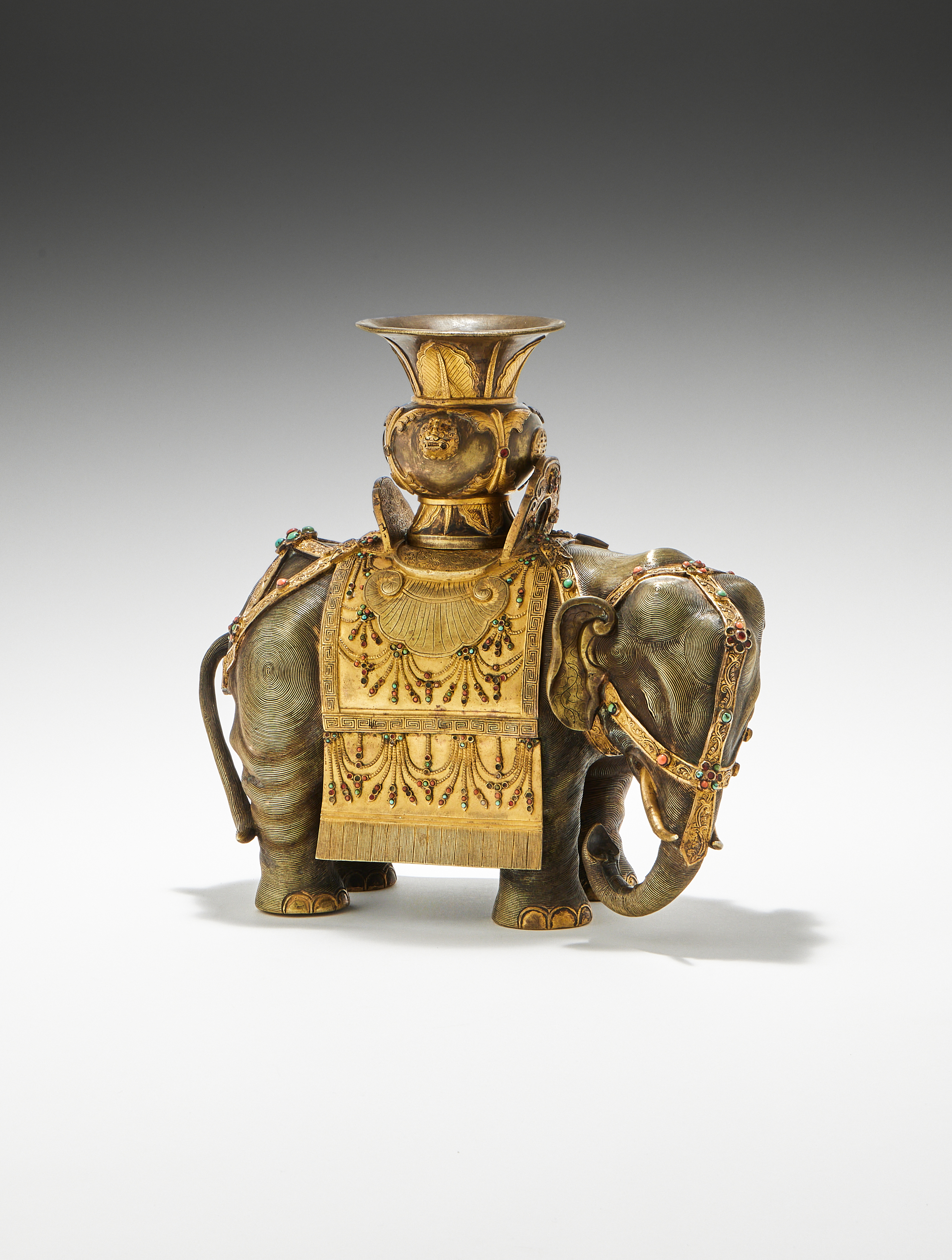 A fine Chinese Imperial bronze caparisoned 'elephant and vase', Qianlong Period (1736-1795)