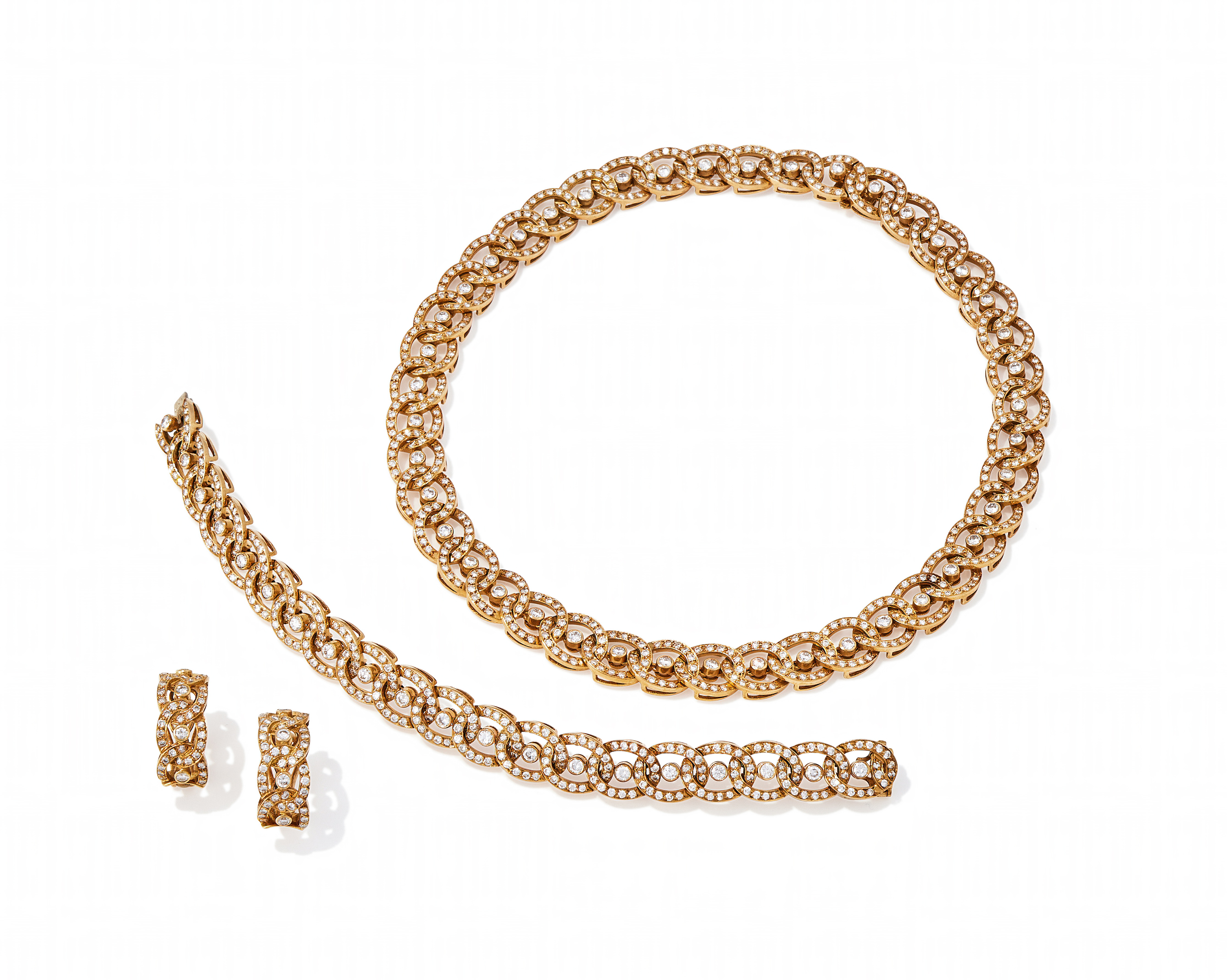 GARRARD, A DIAMOND 'ONE ONE TWO' NECKLACE, BRACELET AND EARRING SUITE, CIRCA 1989