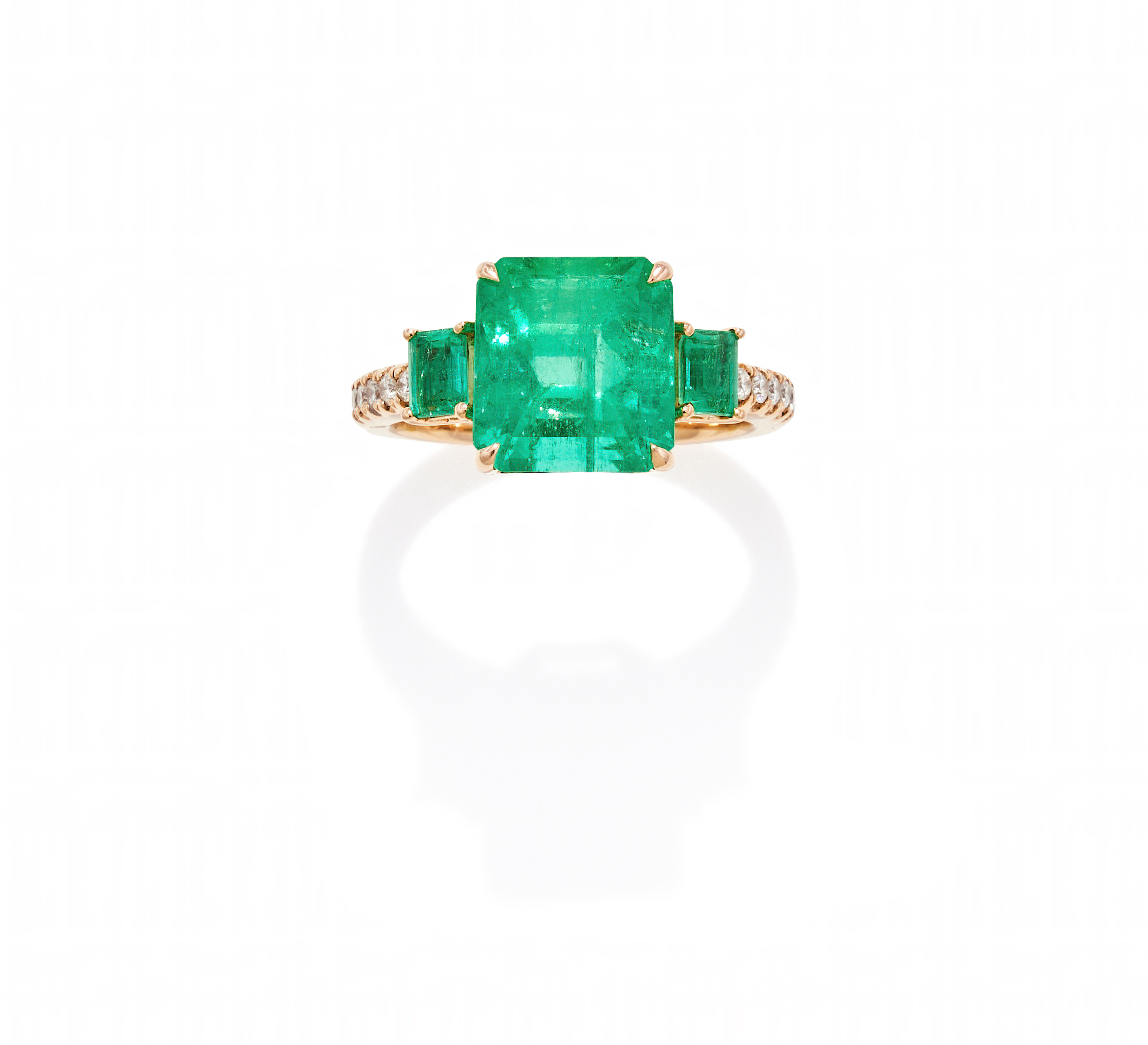 AN EMERALD AND DIAMOND RING