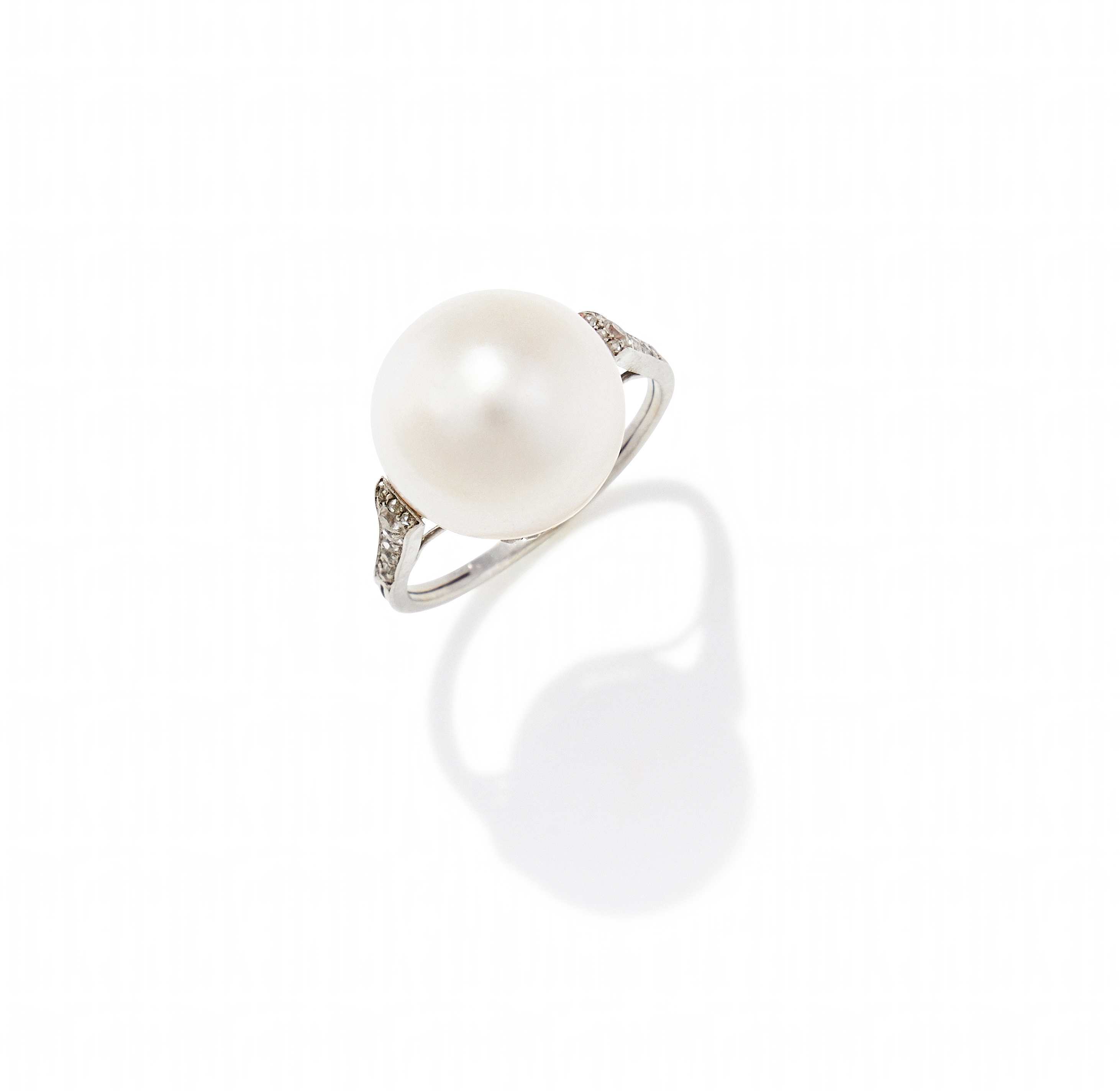 AN EARLY 20TH CENTURY NATURAL PEARL AND DIAMOND RING