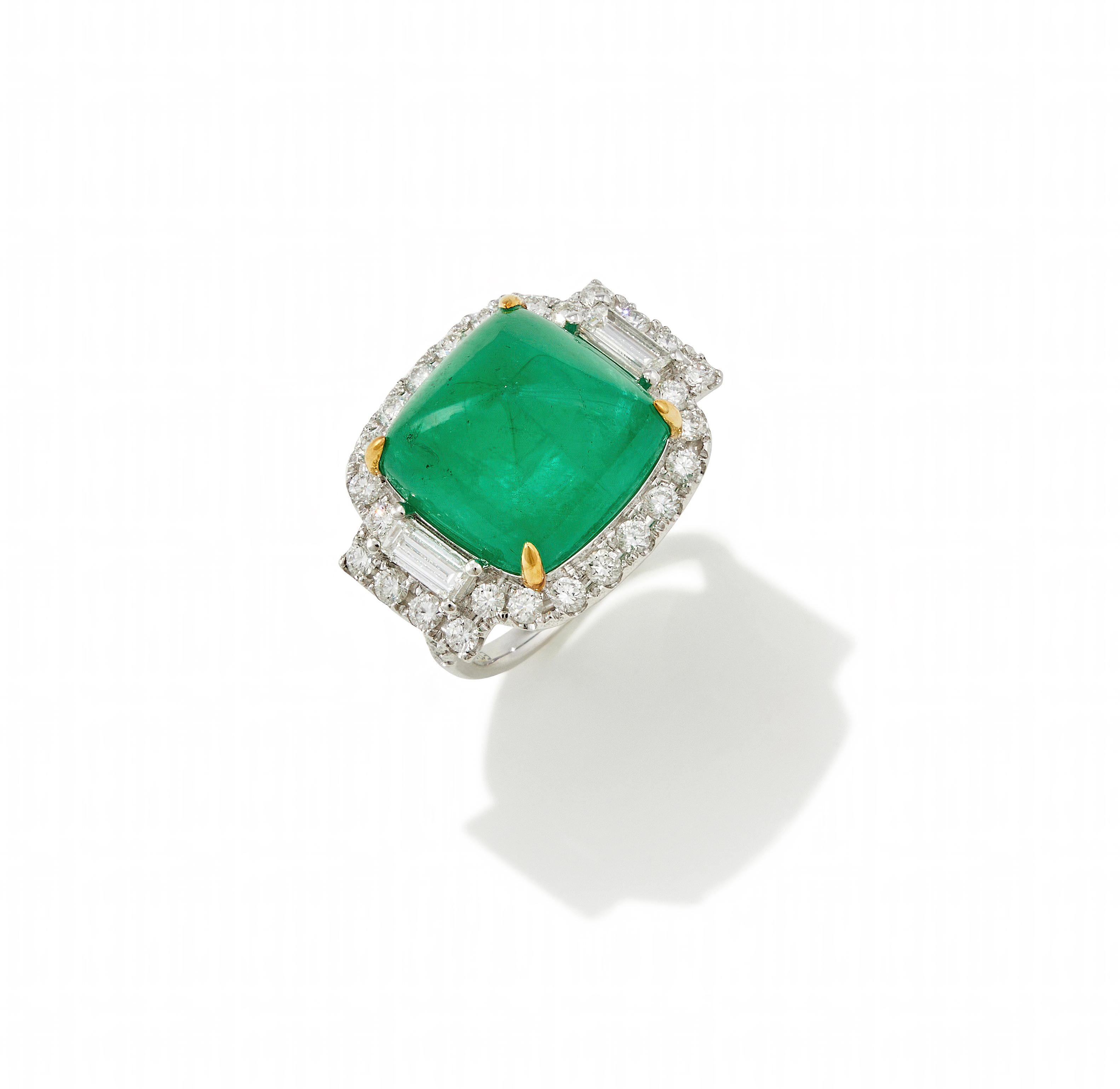 AN EMERALD AND DIAMOND DRESS RING