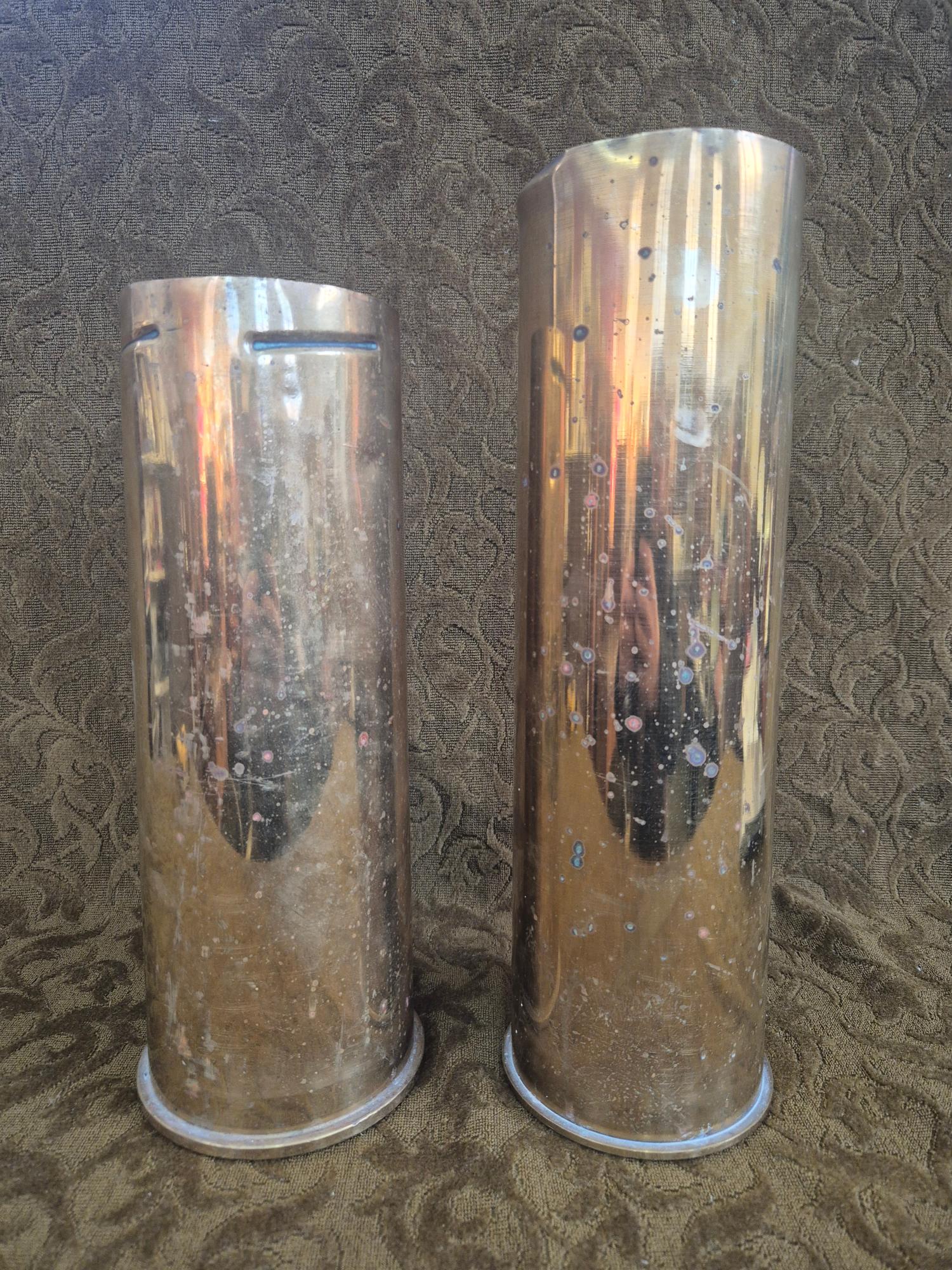 2 x large brass shell casings standing 37cm and 33cm tall, 5.8kg.