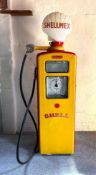 A c.1950s 'Shell'-Branded Beckmeter Petrol Pump Finished in the red and yellow colours of Shell,