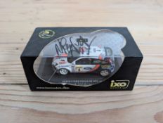 A 1:43 Scale Model of the WRC Ford Focus RS - Signed by Colin McRae Boxed, produced by ixo Models.