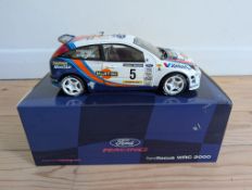 A 1:18 Scale Model of the WRC Ford Focus RS - Signed by Colin McRae and Nicky Grist Boxed,