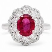 18ct white gold unheated oval ruby and round brilliant cut diamond cluster ring