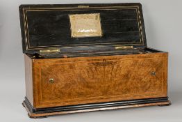 antique because of the big size quite rare musical box with organ and 12 tunes and with a case in bu