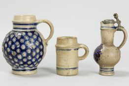 3pcs of Westerwald stoneware with a small mug, a 17th Cent. beer mug and a jug with lid in tin