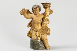 antique baroque style candlestick in polychromed wood and in the shape of a sitting Angel