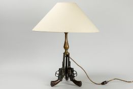 table lamp with three revolvers as base