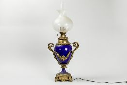 antique paraffin lamp in porcelain and bronze with its original glass shade