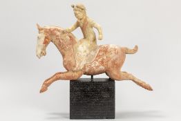 Chinese Tang Dynasty tomb "Polo playing" figure in earthenware with well preserved polychromy