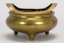 Chinese marked incence burner on three feet in a copper alloy