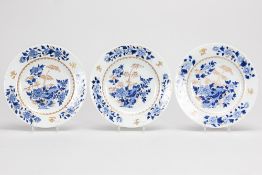 series of three 18th Cent. Chinese plates in porcelain with a blue-white and gold garden decor 