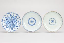 3 Chinese plates in porcelain with floral blue-white decor a pair of the 18th Cent. and a KangXi one