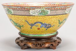 nice quite big Chinese bowl in porcelain with a rich Qing decor with dragons on a yellow background