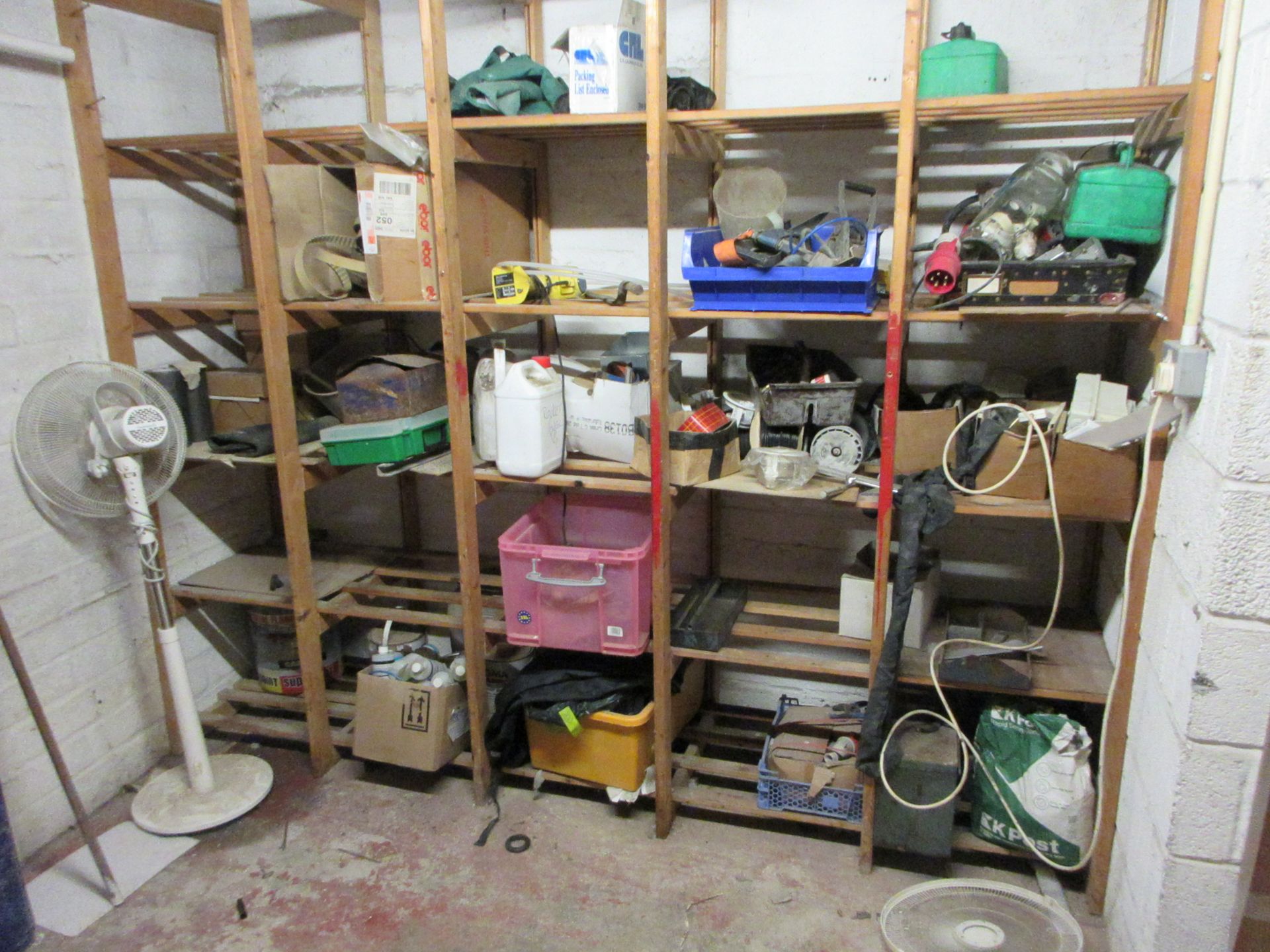 Loose contents of storage room to include fuel cans, pedestal fans, tools, hand tools, microwaves,
