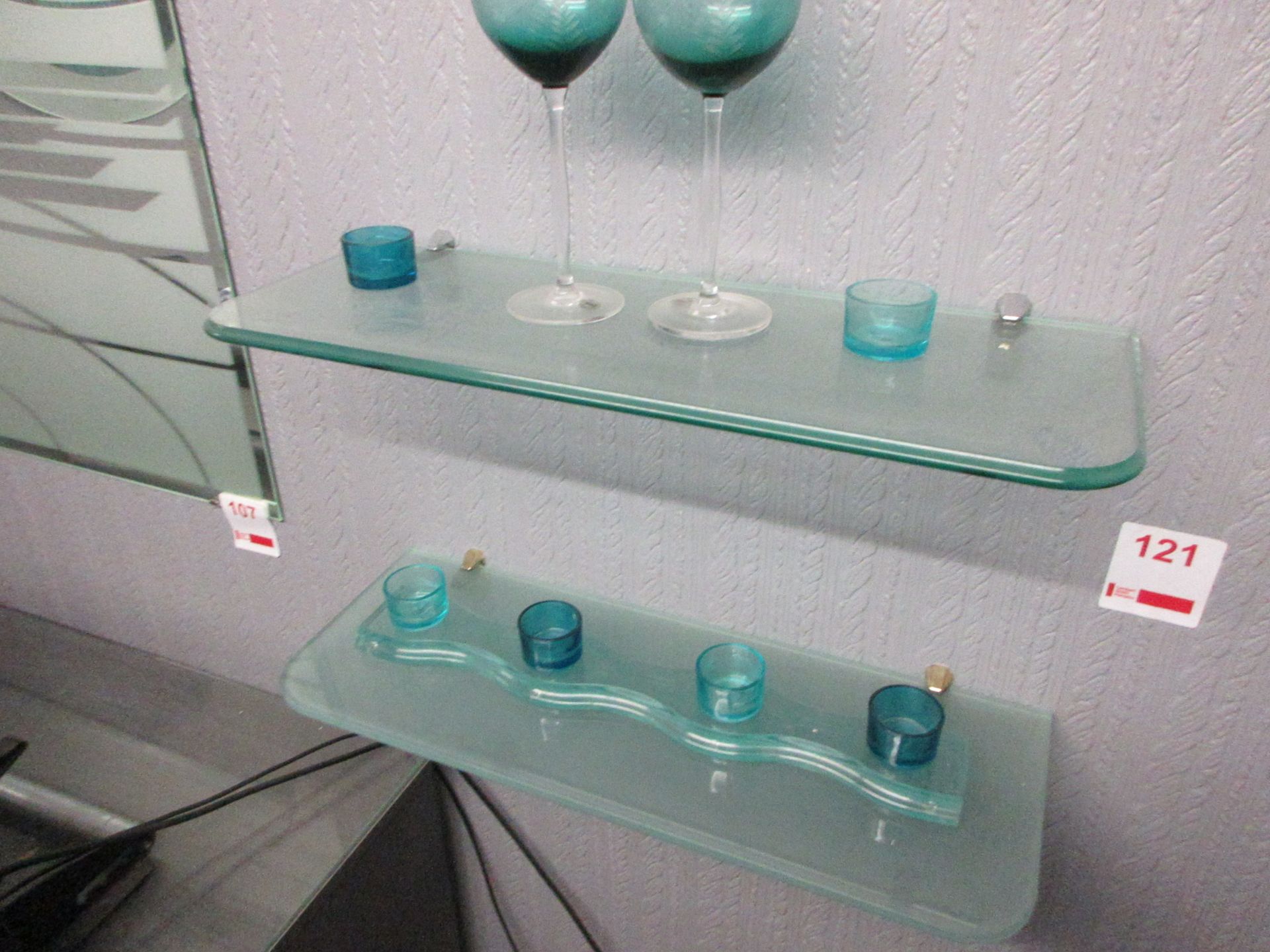Two glass shelves, 1 x 600 x 220mm, 1 x 590 x 220mm with various tee light holder, 2 x coloured