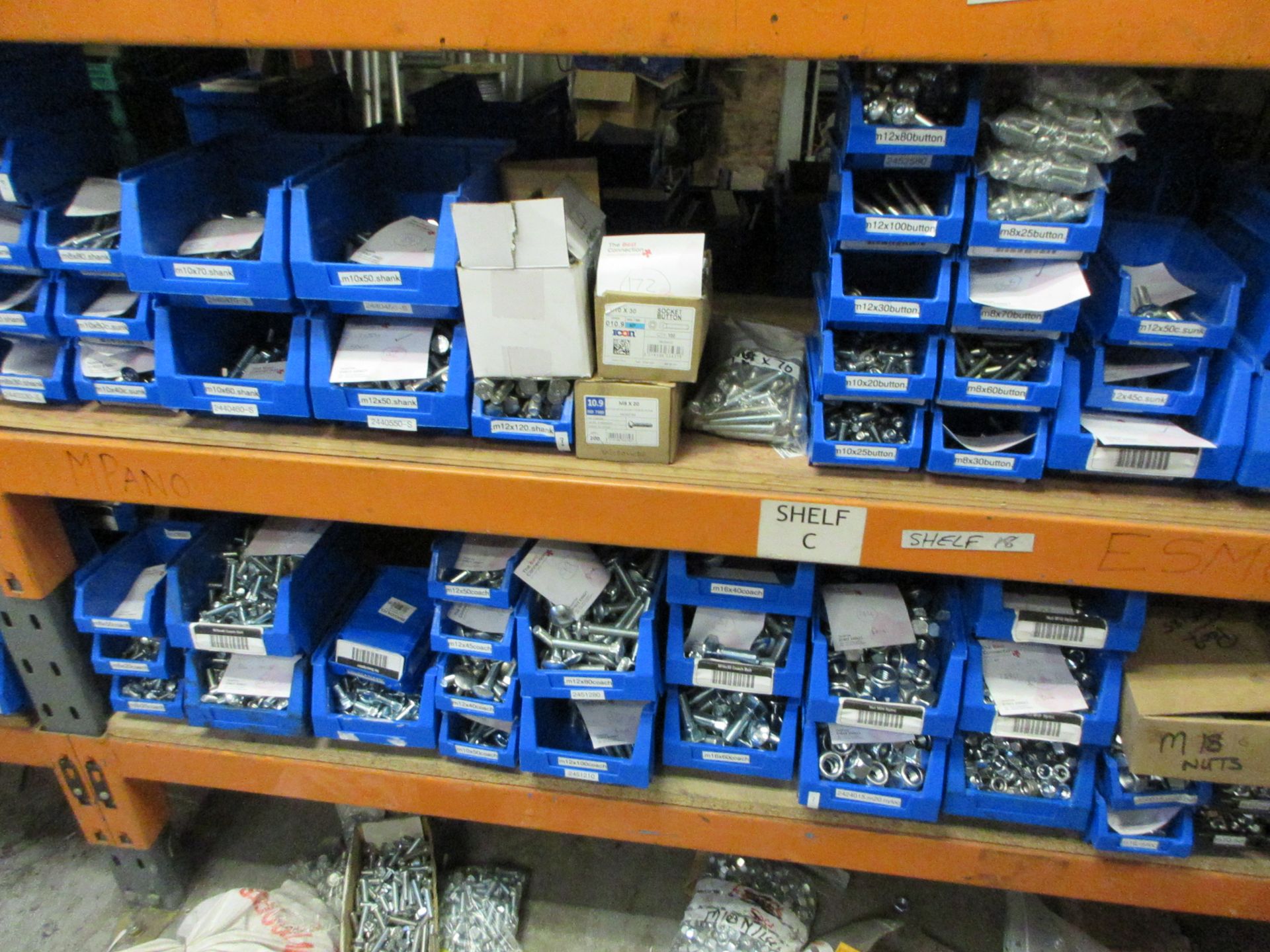 Contents of bay of racking including large quantity of nuts and bolts ...