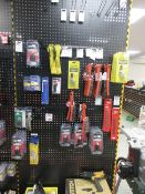 Contents of shop display racking including wire brushes, chucks, vice grips, files, grease