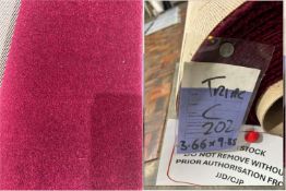 Part roll of light red coloured carpet