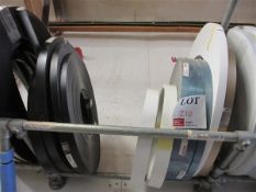 Twelve black, white and blue brushed edge banding rolls