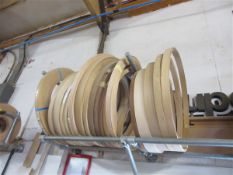 Fourty various sized rolls of wood effect edge banding