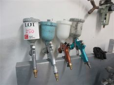 Four various pneumatic spray guns & hoppers
