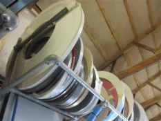 Thirty one various sized and coloured edge banding rolls
