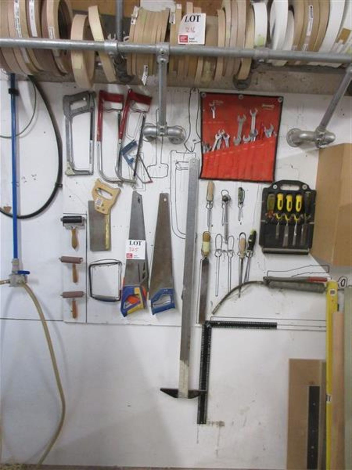 Selection of various hand tools to include saws, spanners, chisels and set square