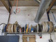 Seventy nine various sized and coloured rolls of edge banding